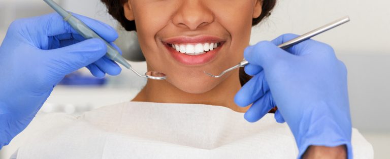 beautiful female smile and dentist